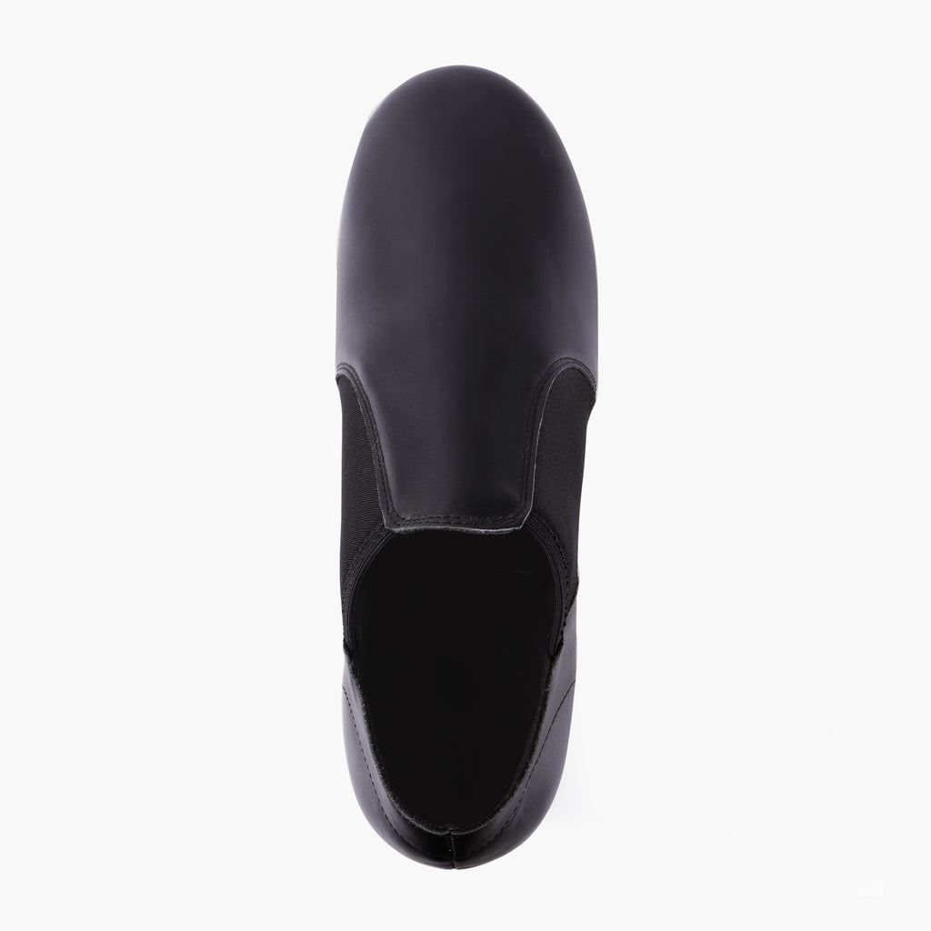 Top view of Linodes black slip-on jazz shoes with low topline and clean vamp