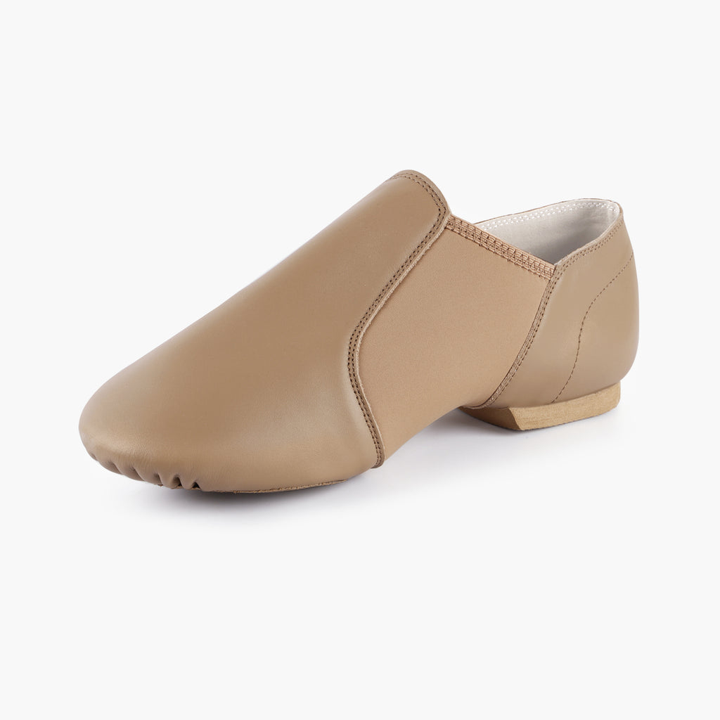 Side view of Linodes adult tan slip-on jazz shoes with neoprene arch support