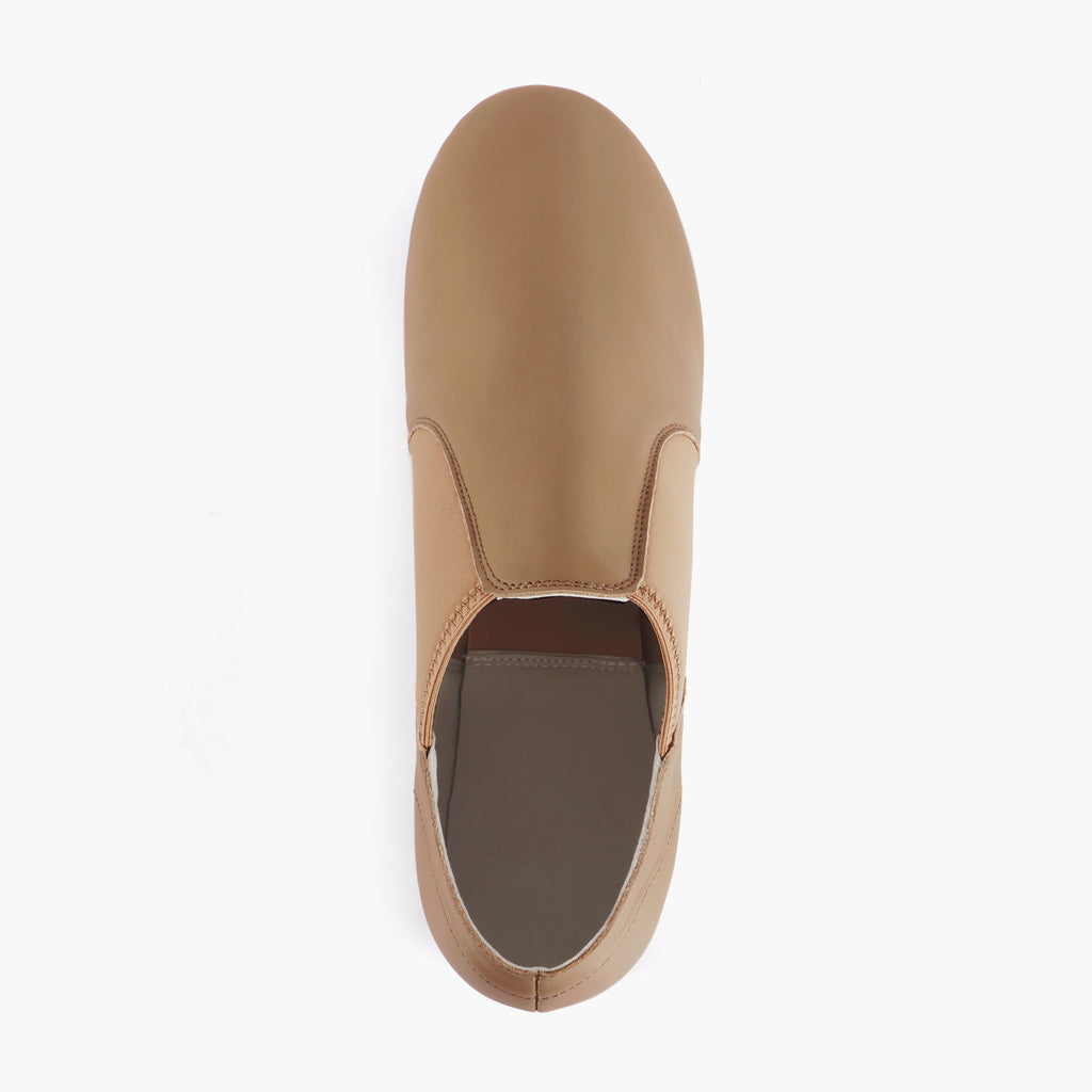 Top view of Linodes tan slip-on jazz shoes with smooth vamp