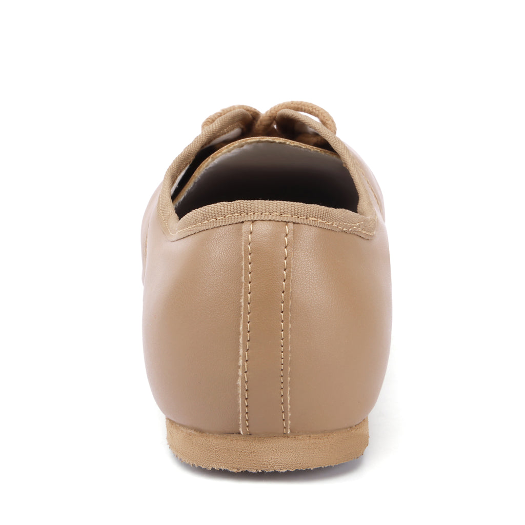 Back view of Linodes tan PU leather jazz shoes with low heel