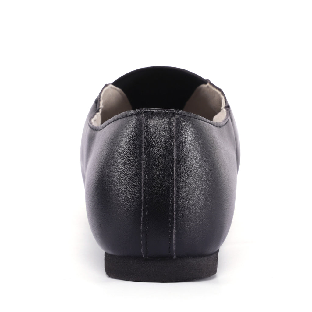 Back view of Linodes women’s black PU leather jazz booties with low heel