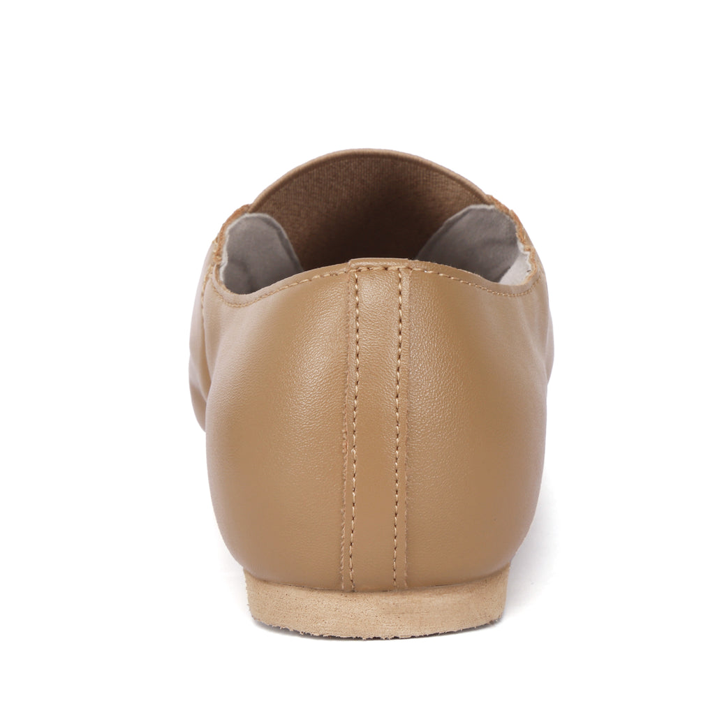 Back view of Linodes women’s tan PU leather jazz booties with low heel